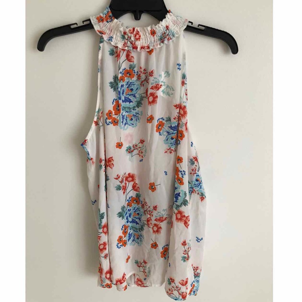 white floral top size large but fits like medium